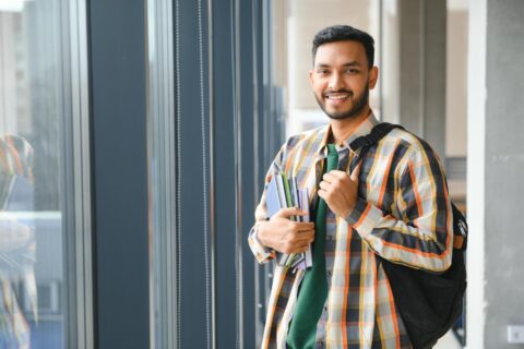 happy-indian-male-student-university-min